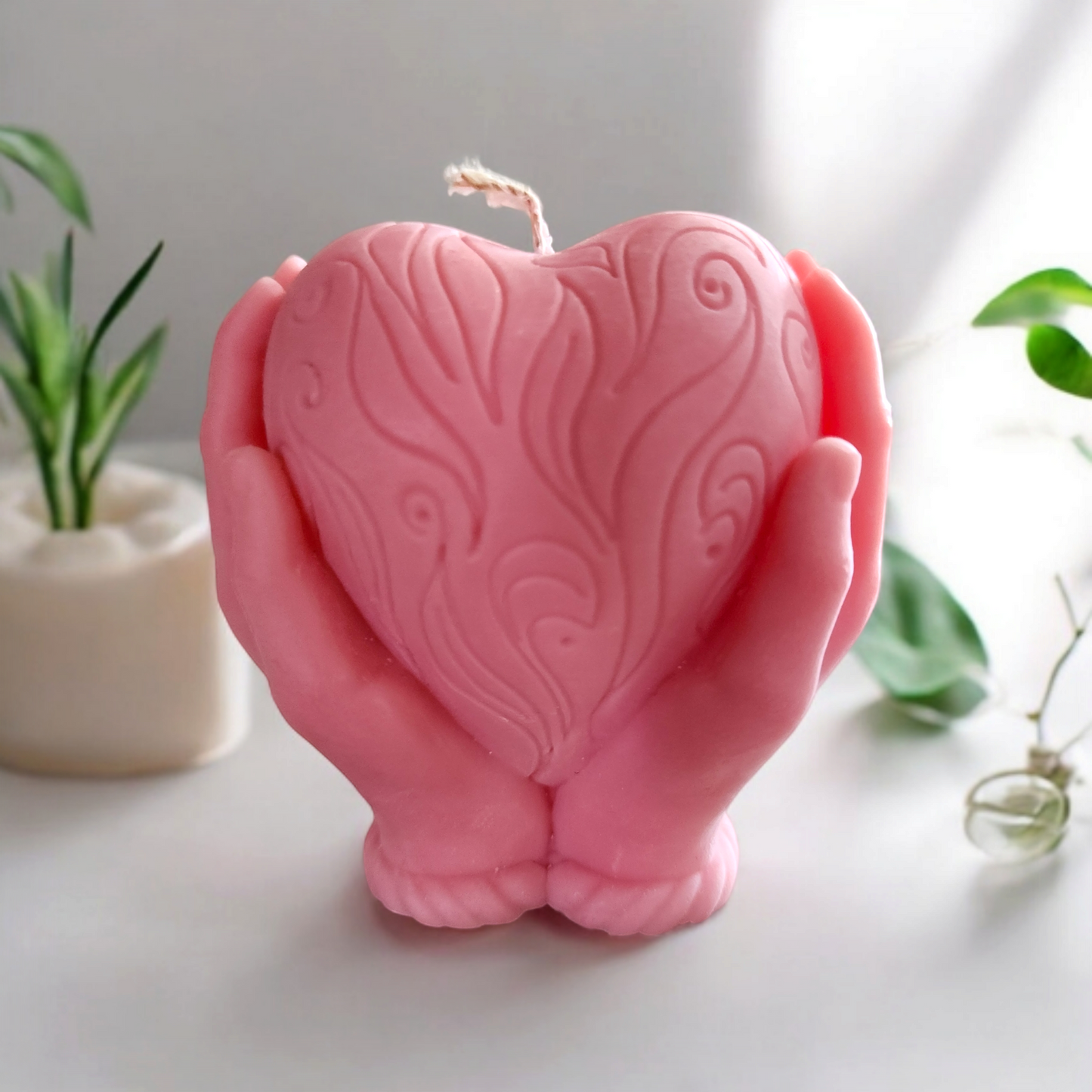 "Heart in Hand: Sculpted Candle"