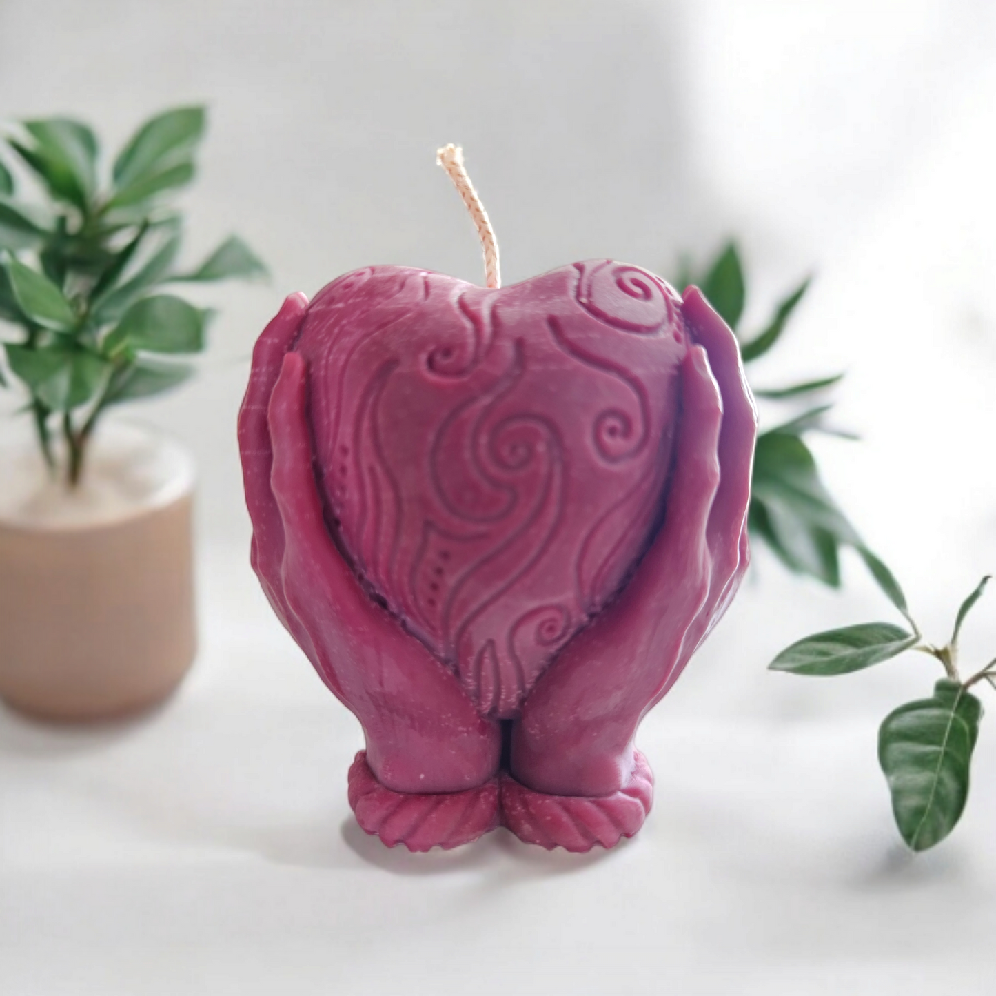 "Heart in Hand: Sculpted Candle"